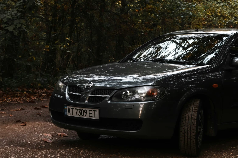 the small car is black in color with dark stripes