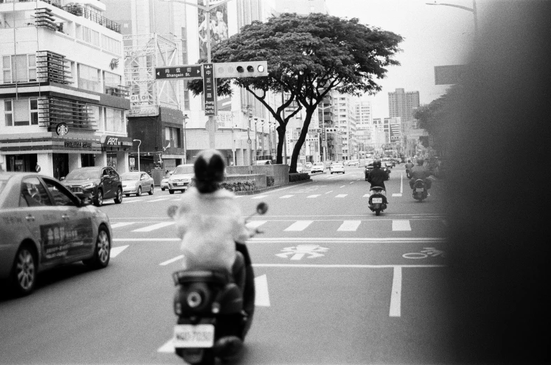 a person riding a bike down a street