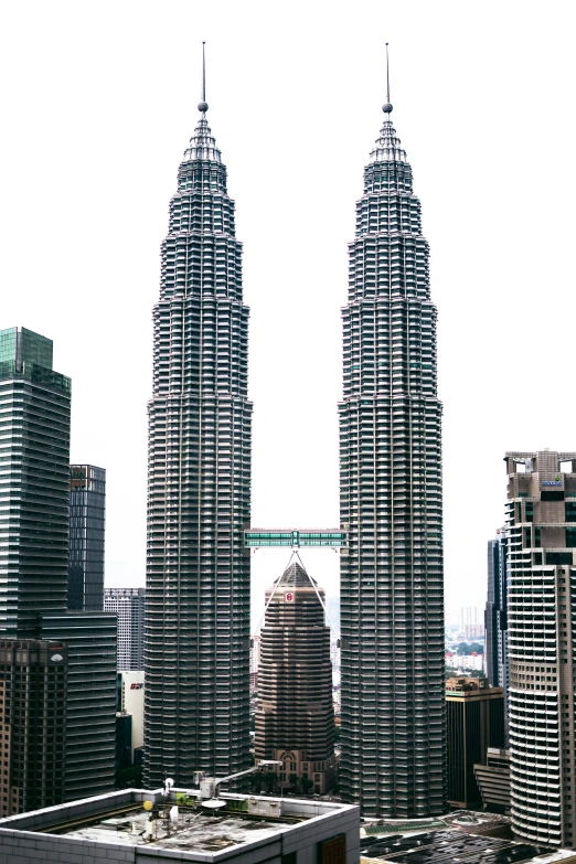 a city with tall buildings, two of which appear to be very high rise