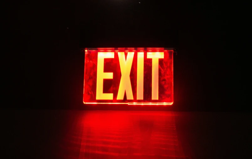 the words exit are red on a white background