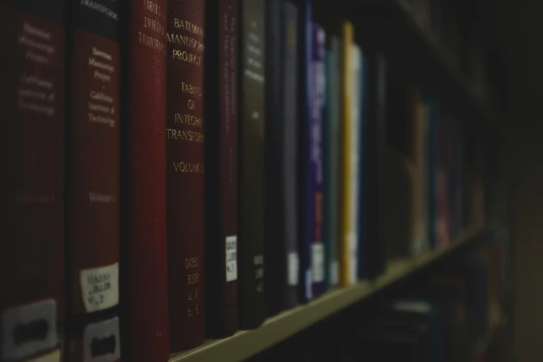 a row of books are in a room