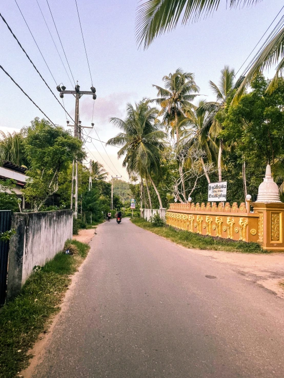 a view of a road in front of a house