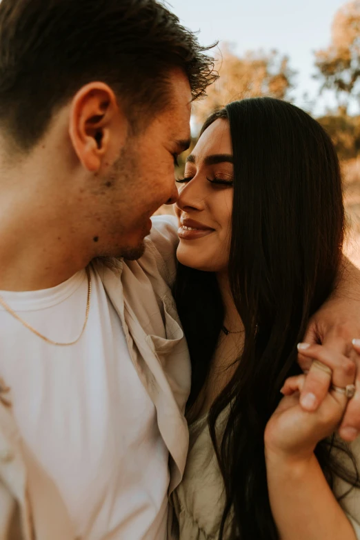 a young couple poses for a close up portrait