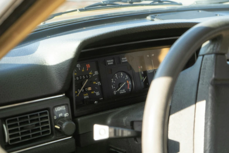 a dashboard in a car with a digital meter