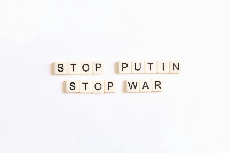 letters spelling stop, put in, stop war