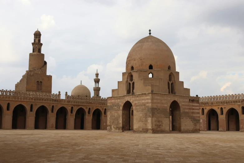 the mina towers are set against an overcast sky