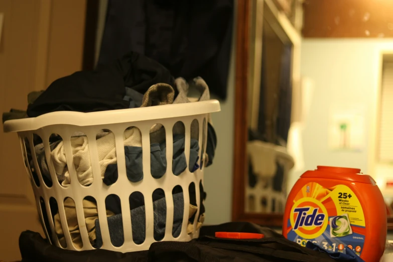 a laundry basket that is filled with clothing