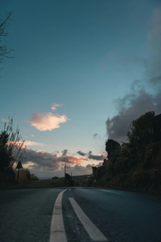 an empty highway with two white stripes on the road