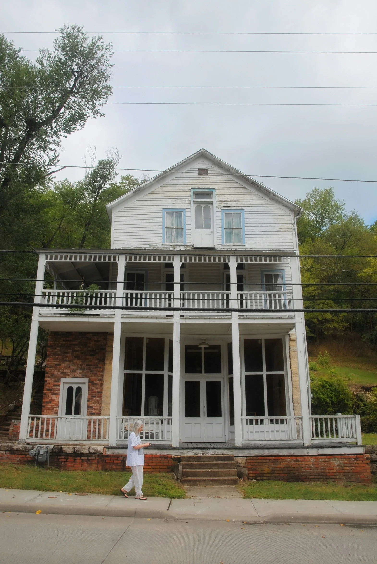 the white house is decorated and has two large porches