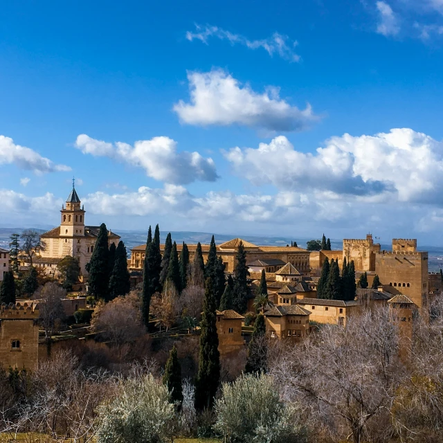 an old castle like village with trees surrounding