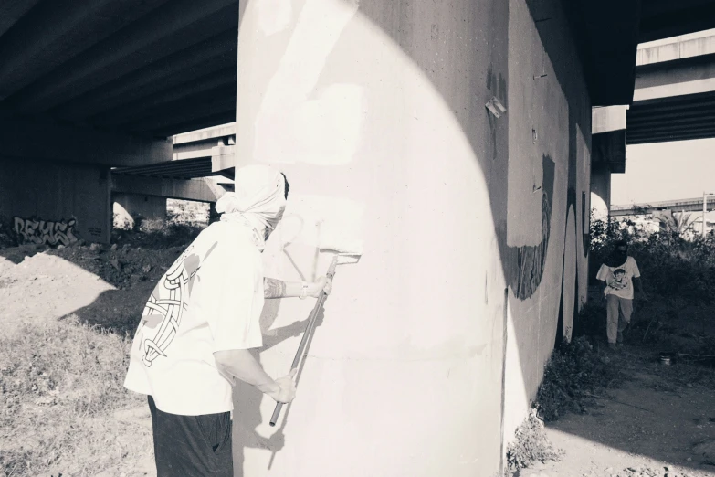 a man is standing next to a surfboard