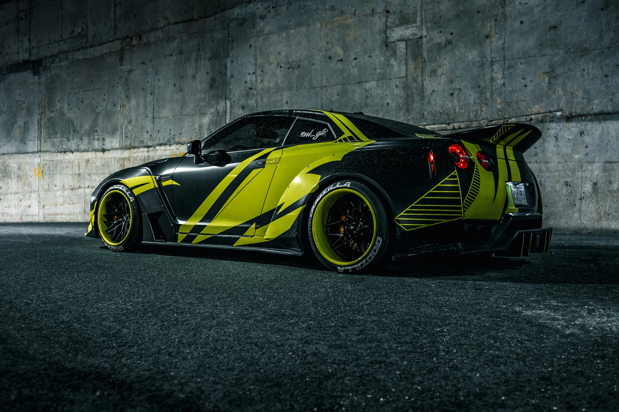 a sports car with a yellow painted stripe