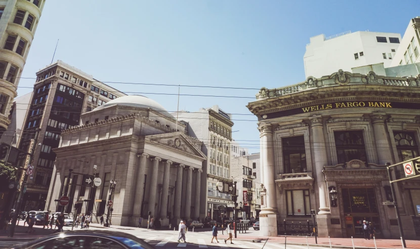 two large buildings sit in the middle of the city