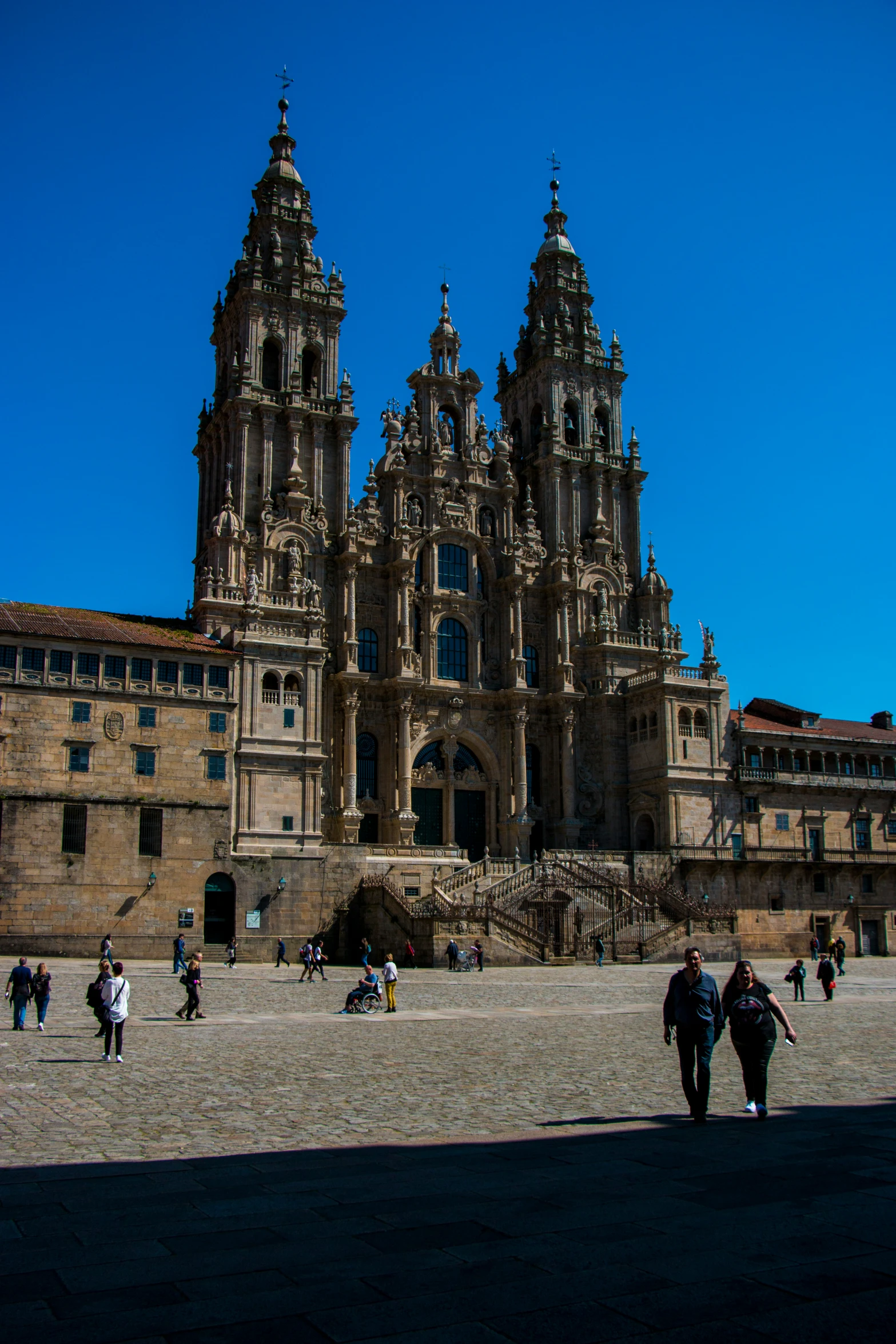 a large building with towers in front of it