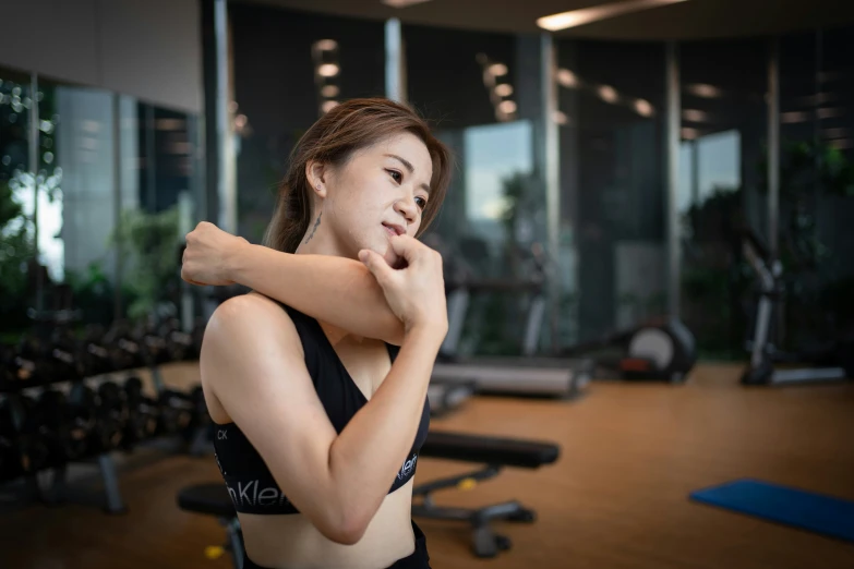 a young woman in a black top is posing for the camera