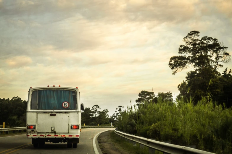 a large bus travels down the road in traffic