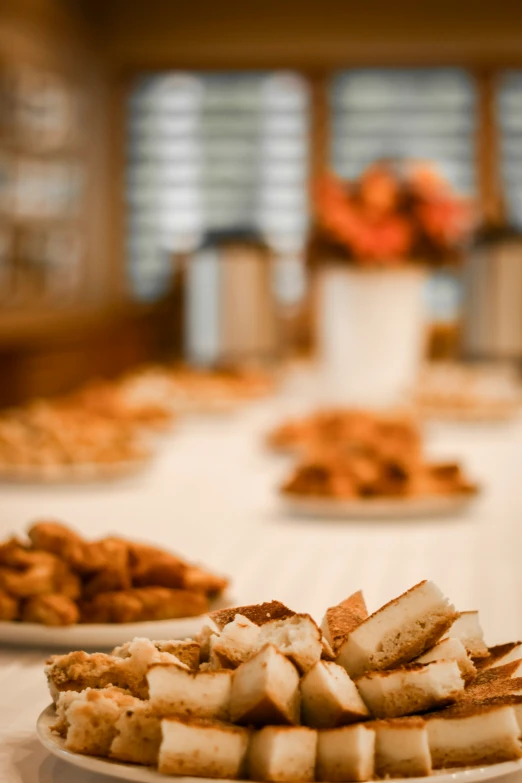 two plates full of food sit on a table in front of another plate