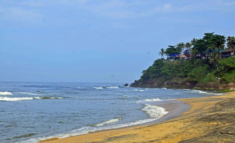 a sandy shore by the ocean on a sunny day