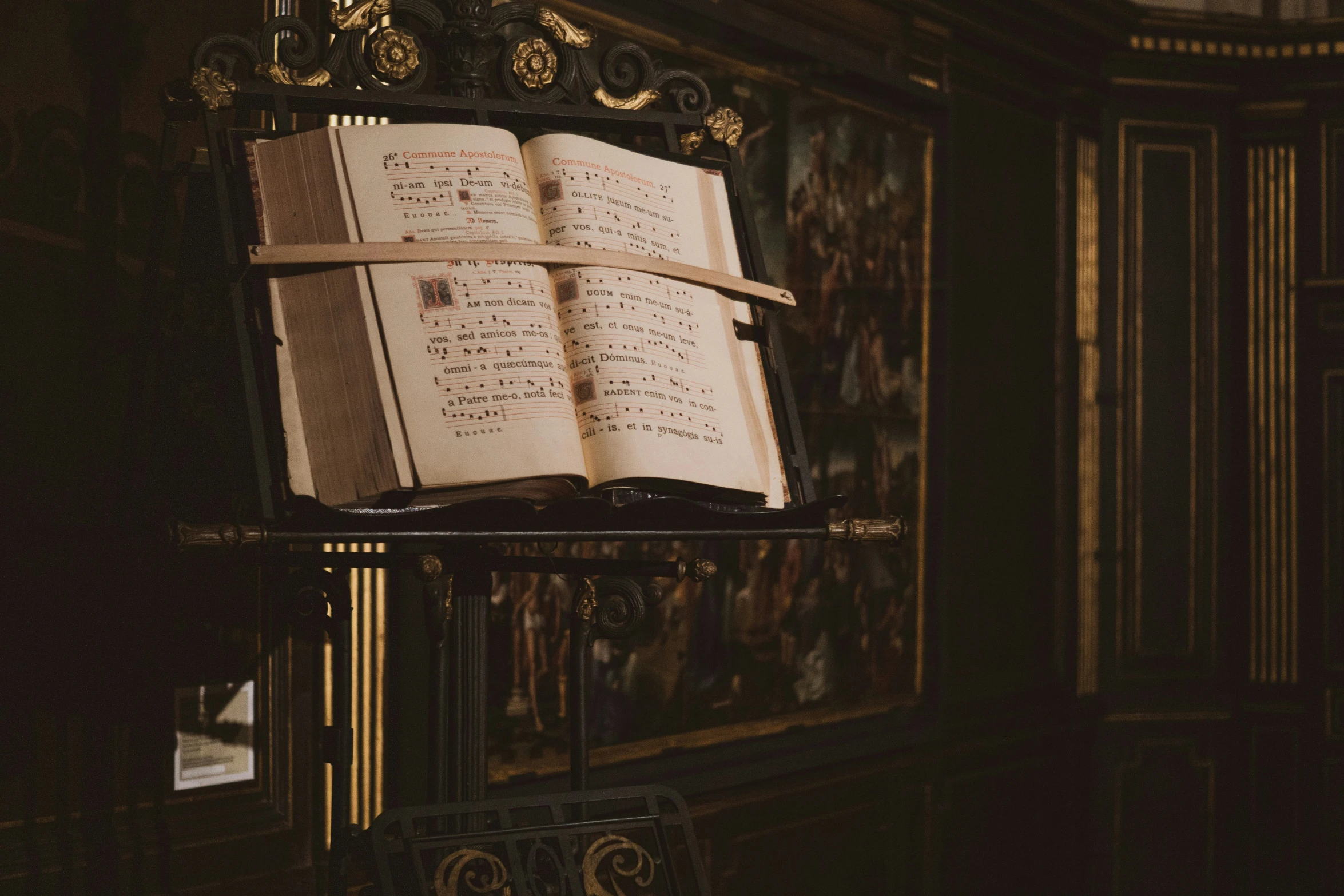 a book on a stand in front of a doorway