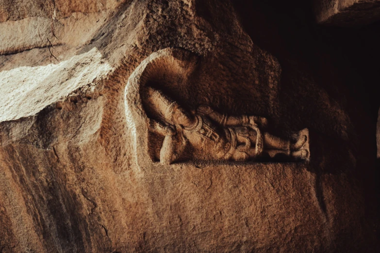 a stone carving of an elephant with its mouth open