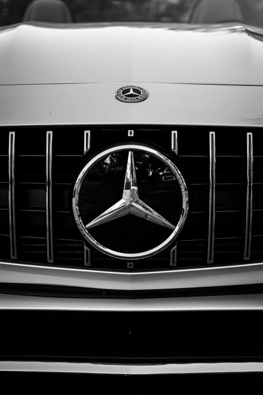 a mercedes logo is shown in the middle of the grille