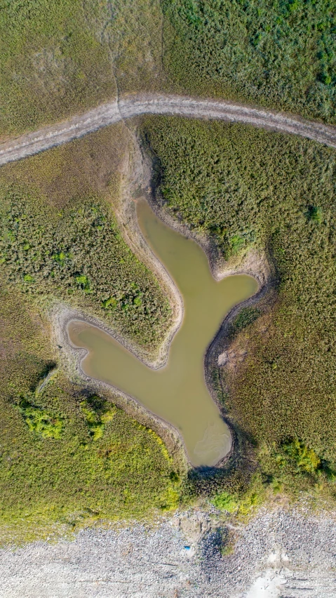 an aerial view of two different roads in a field