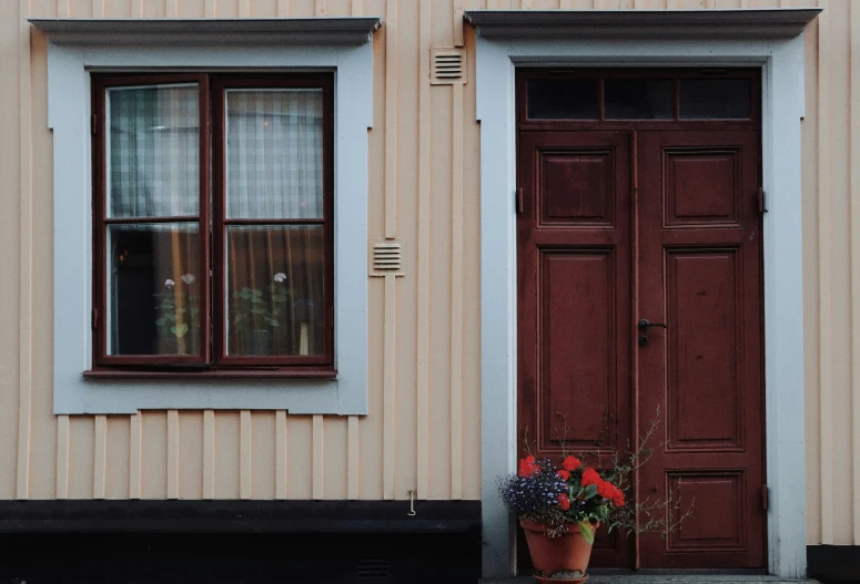 two windows and a door on a building