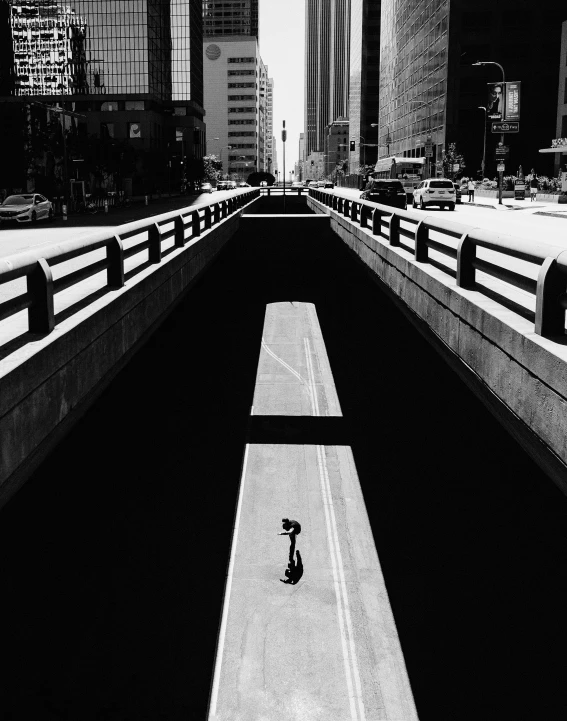 a bike lane in a big city with tall buildings