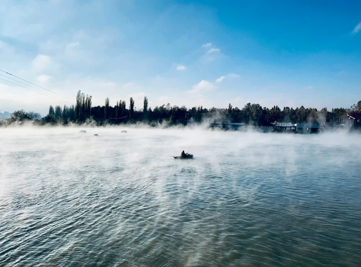 a body of water with small boats floating on it