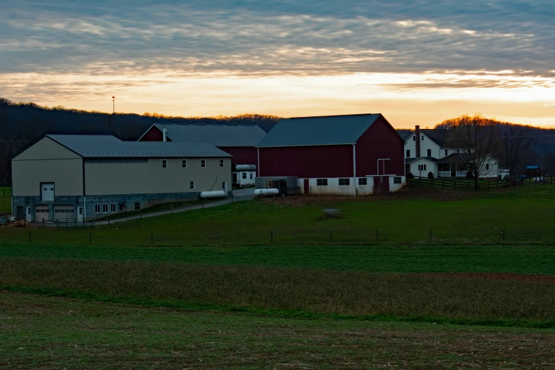 the farm buildings are all next to each other