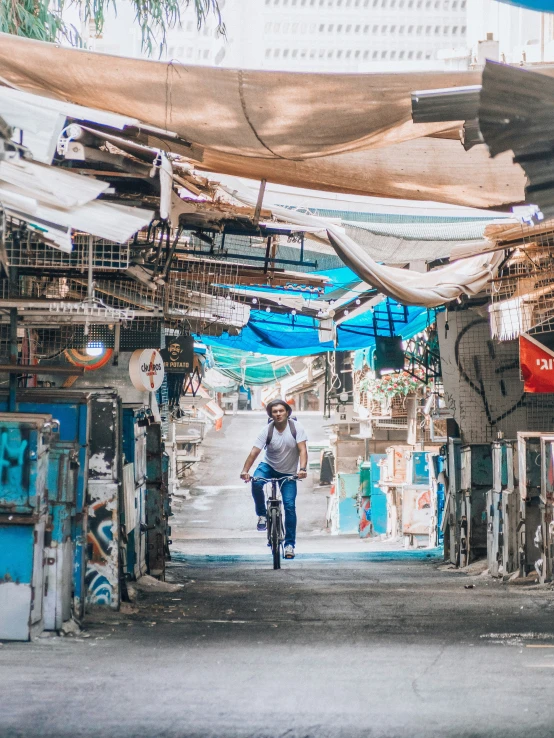 a person riding a bike down a street