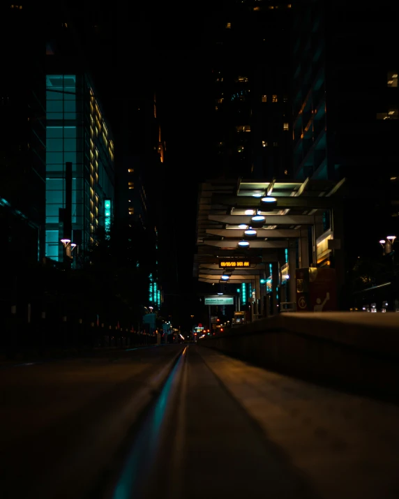 city streets with lit buildings and the dark lighting