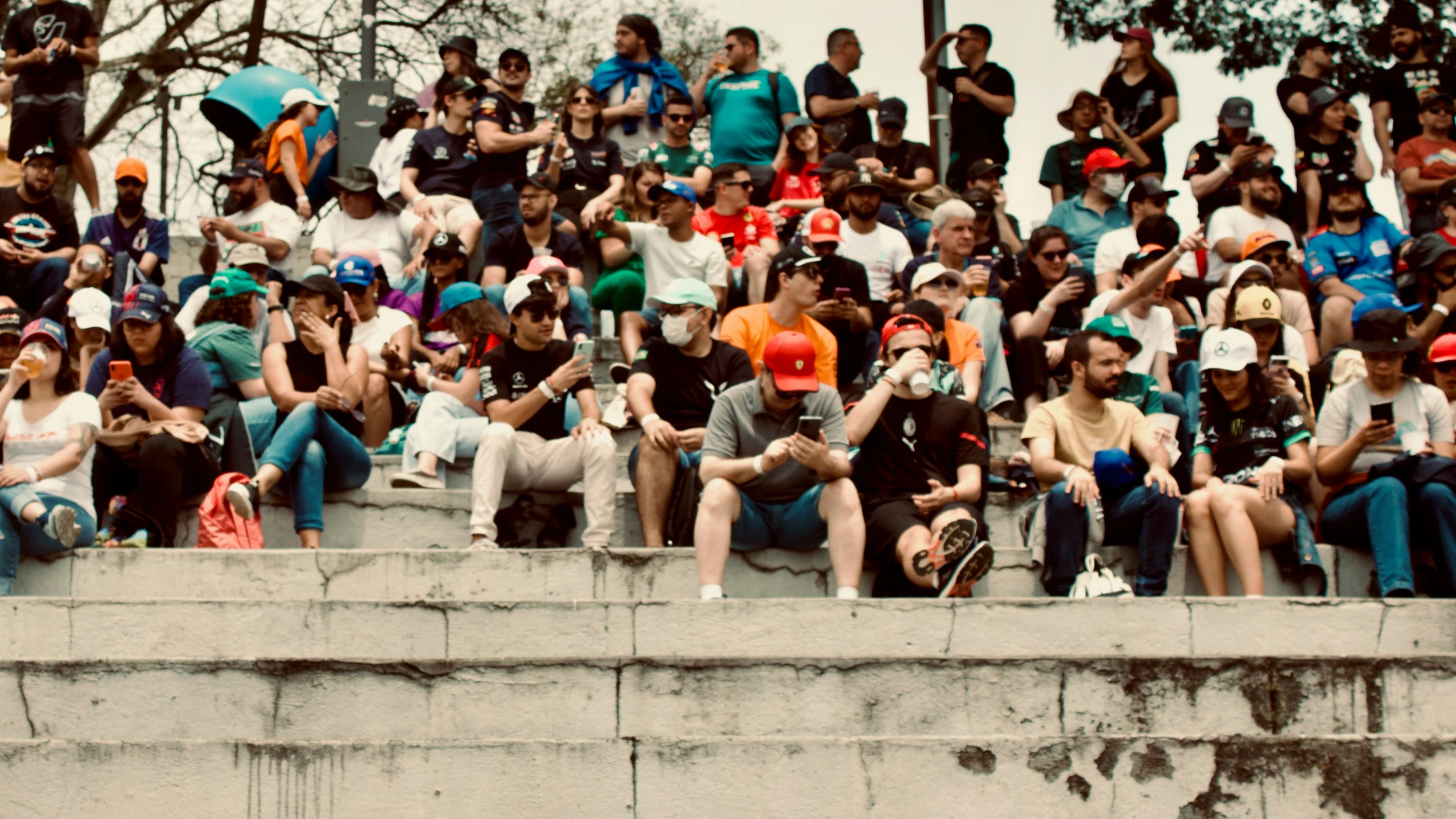 the crowd is watching a skate board race