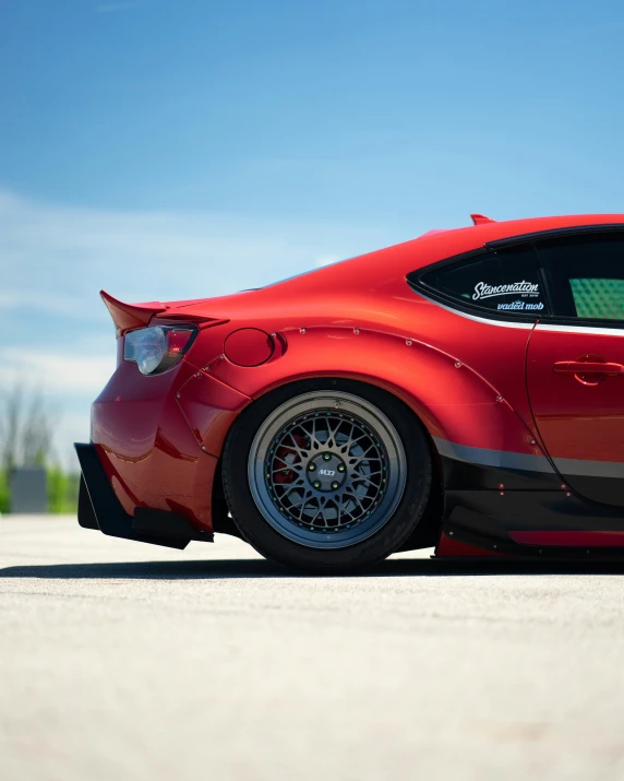 a red sports car parked in a parking lot