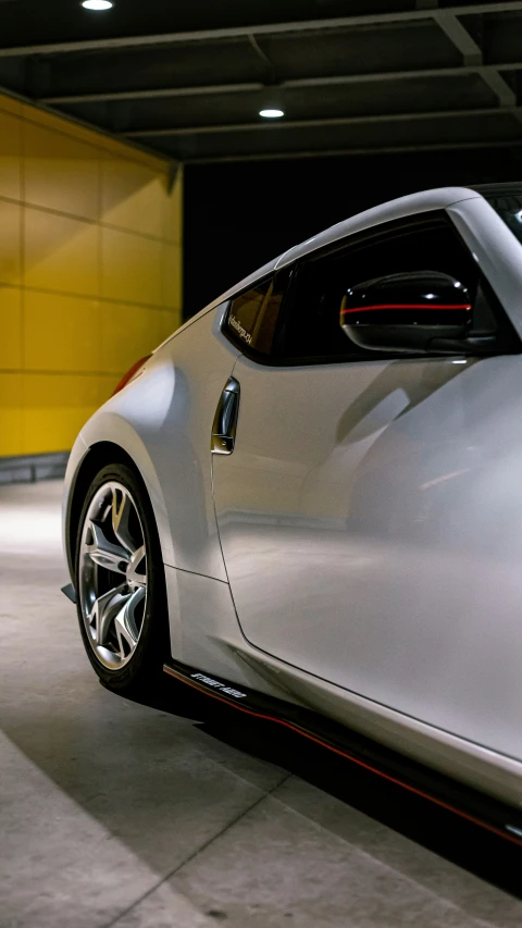 a white sports car parked in a garage