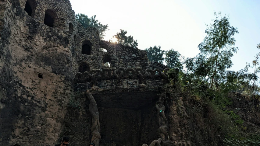 a huge stone structure with some small holes in the middle