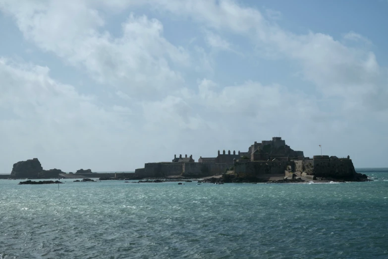 some rocks on an island in the ocean