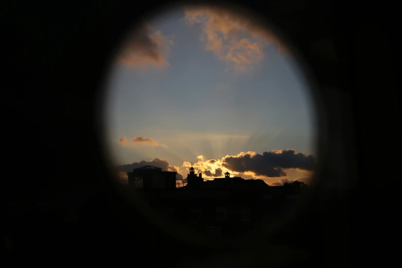 the sunset is shown through the viewfinder