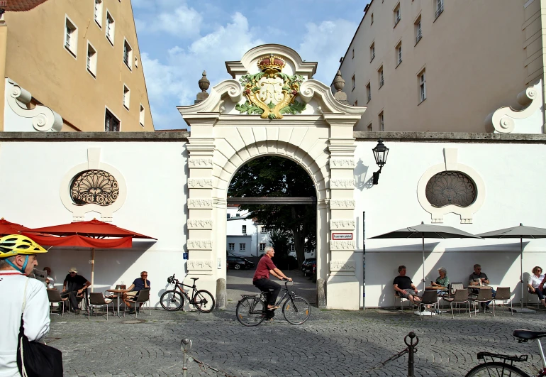 the gate at an outdoor cafe is decorated with clocks