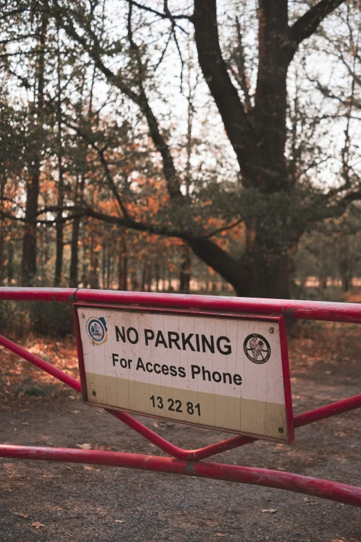 a sign stating that the parking for access phone is below the sign