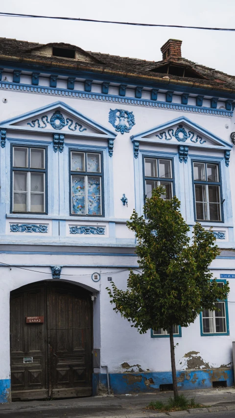 a white building with blue and white designs