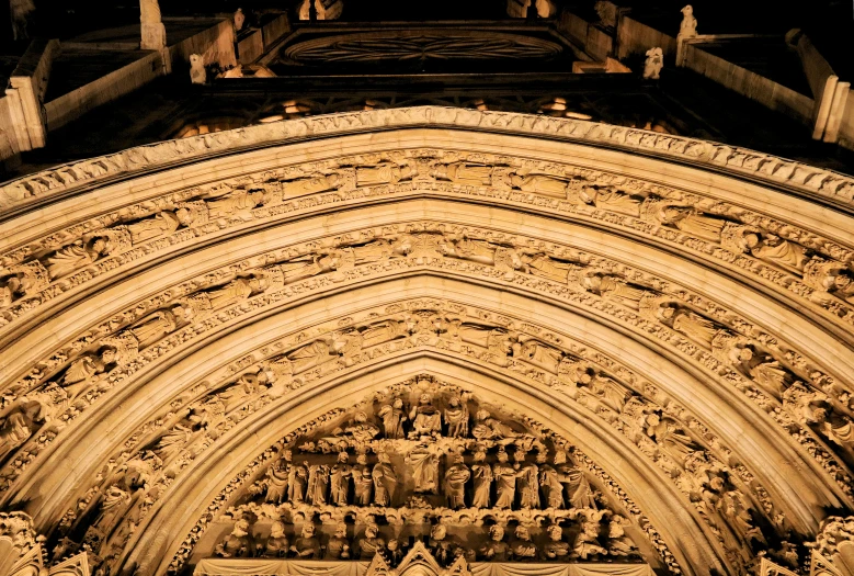 an ornate building is lit up with candles