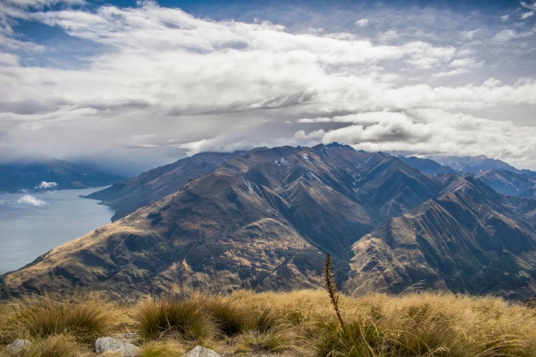 a large mountain that has a very big mountain in the background