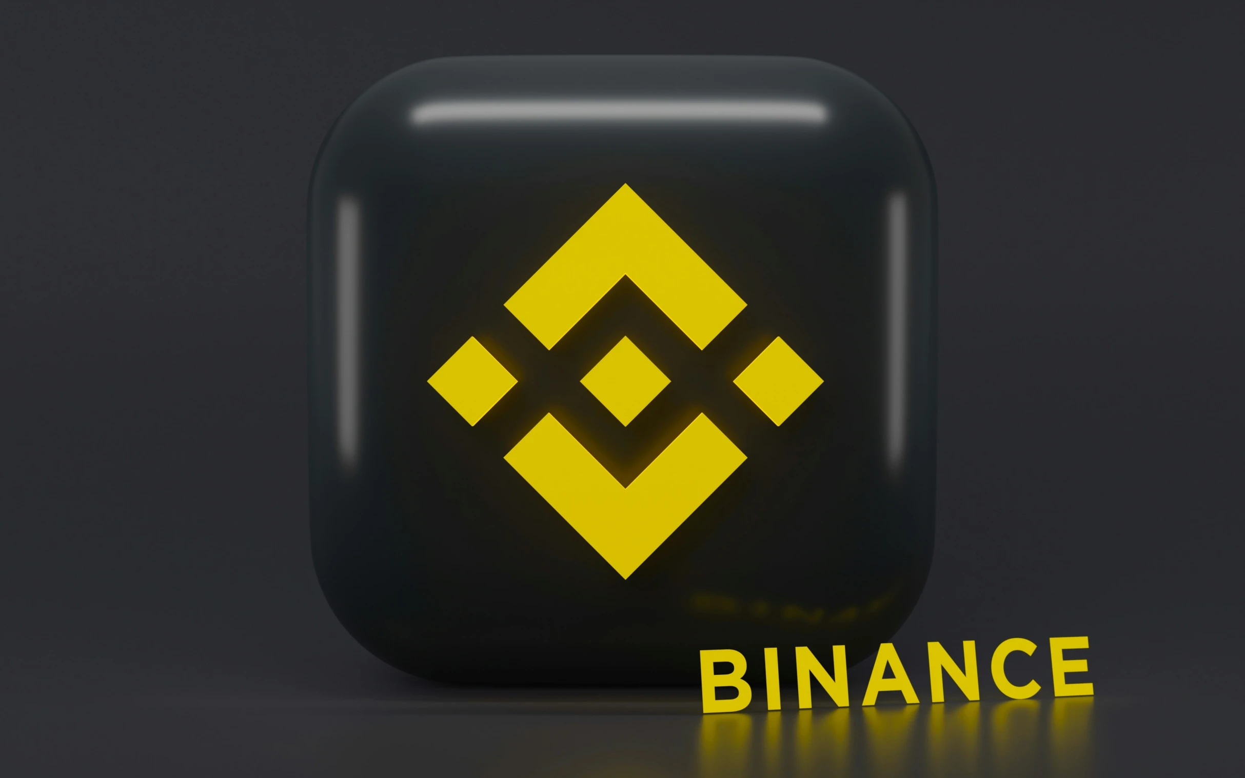 a computer logo designed like a binance, but with an extra yellow symbol in it