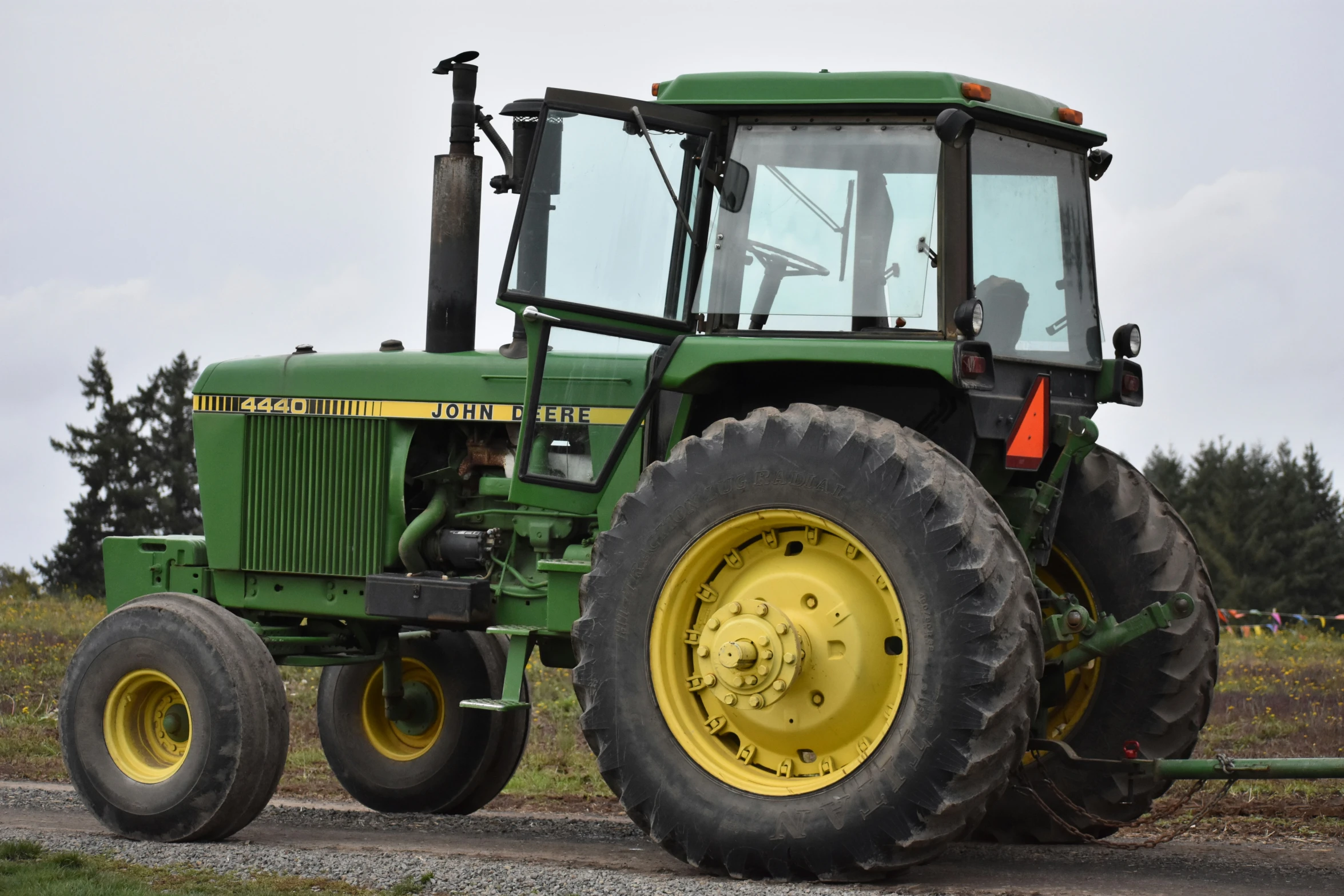 the large tractor has yellow rims