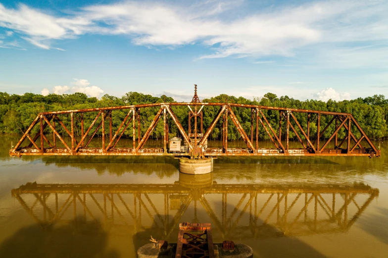 a train trestle on a railroad bridge in a small town