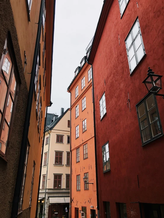 the alley way is lined with old brick buildings