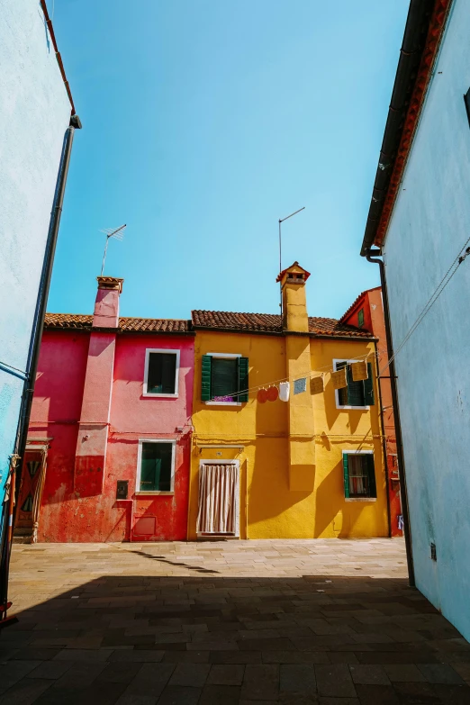 some very tall houses with a bunch of windows