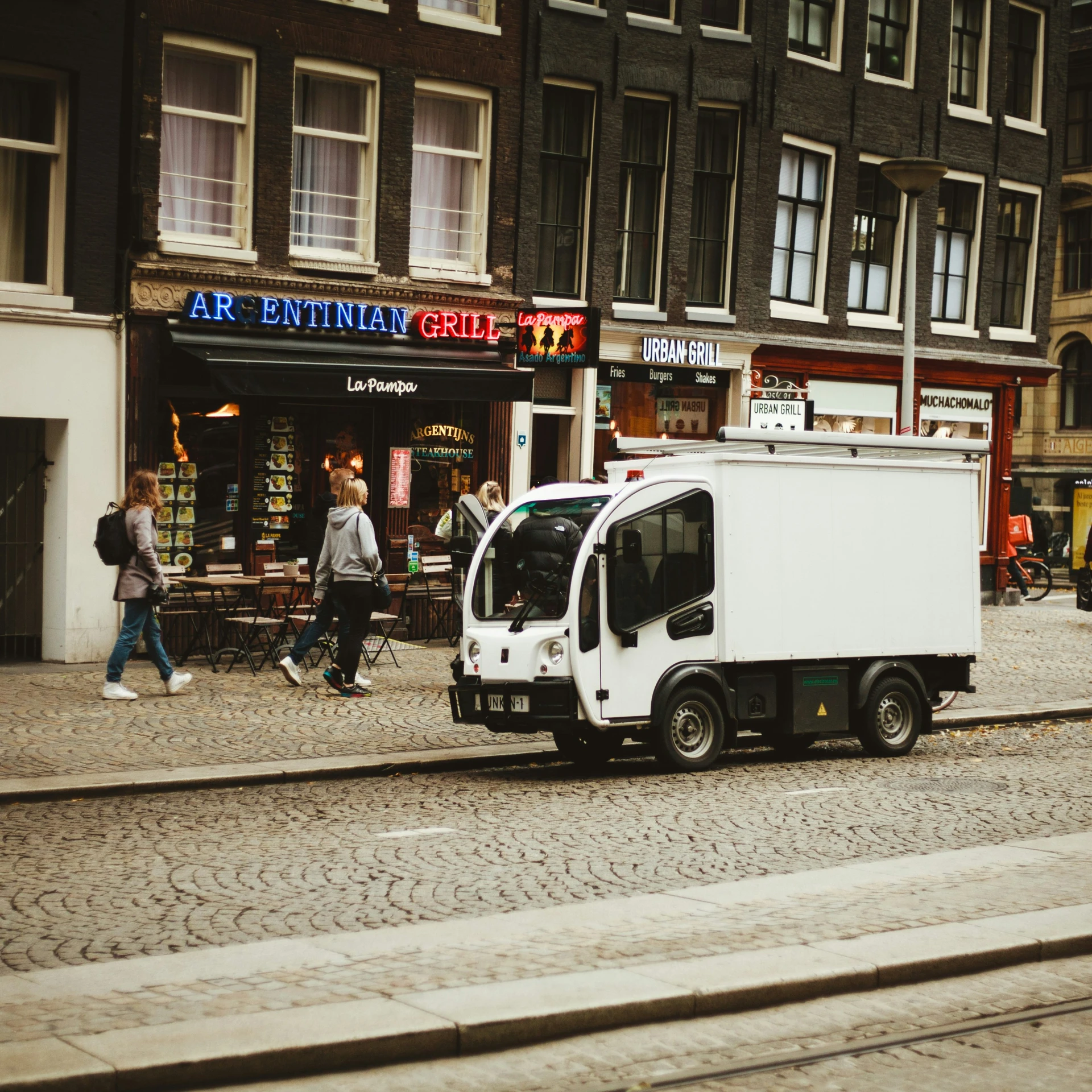 a white truck parked on the side of a road