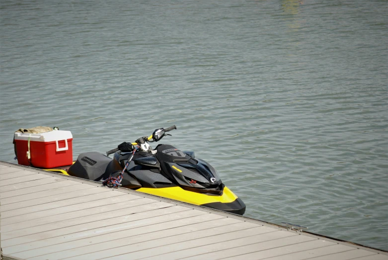 a jet ski parked next to a body of water